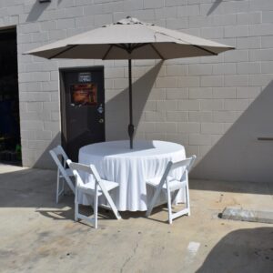 Round Table with  Brown Umbrella & White Resin Chairs